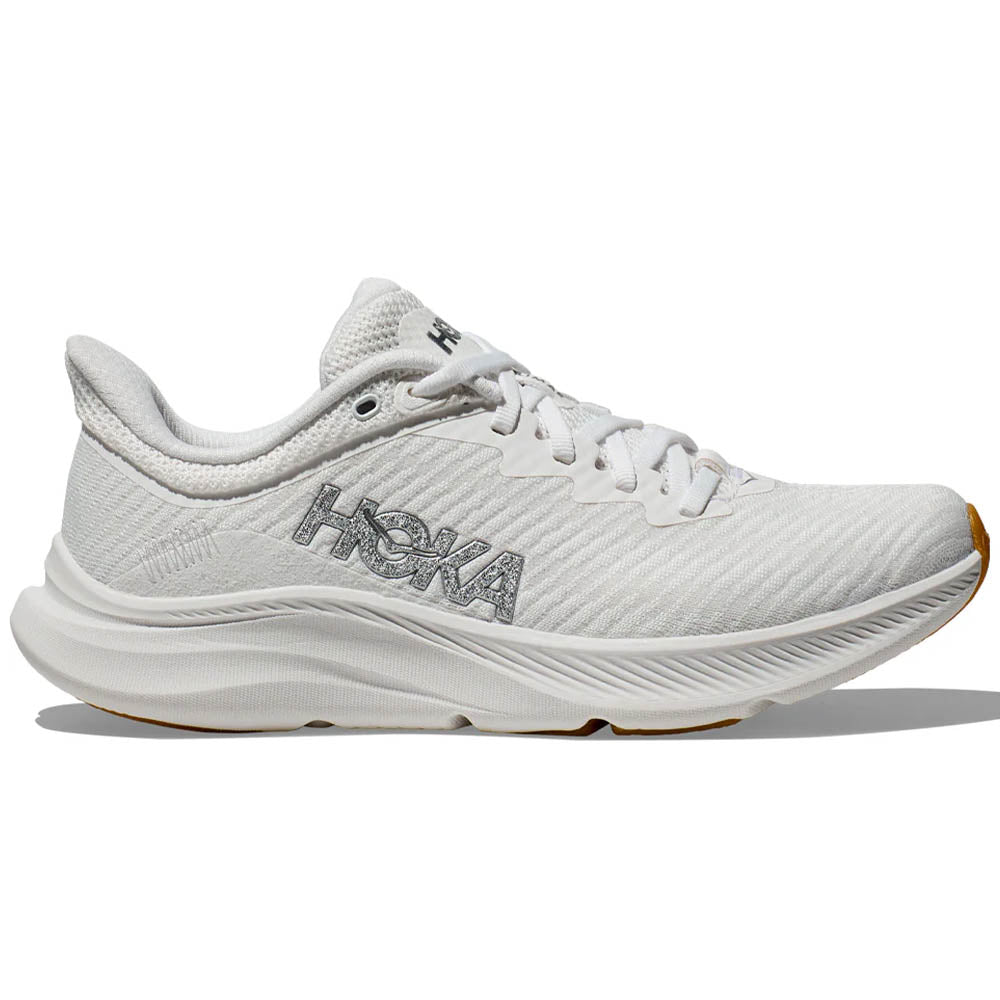 Side view on white background of Womens Hoka Solimar running shoe in White/White, Medium (Regular) width