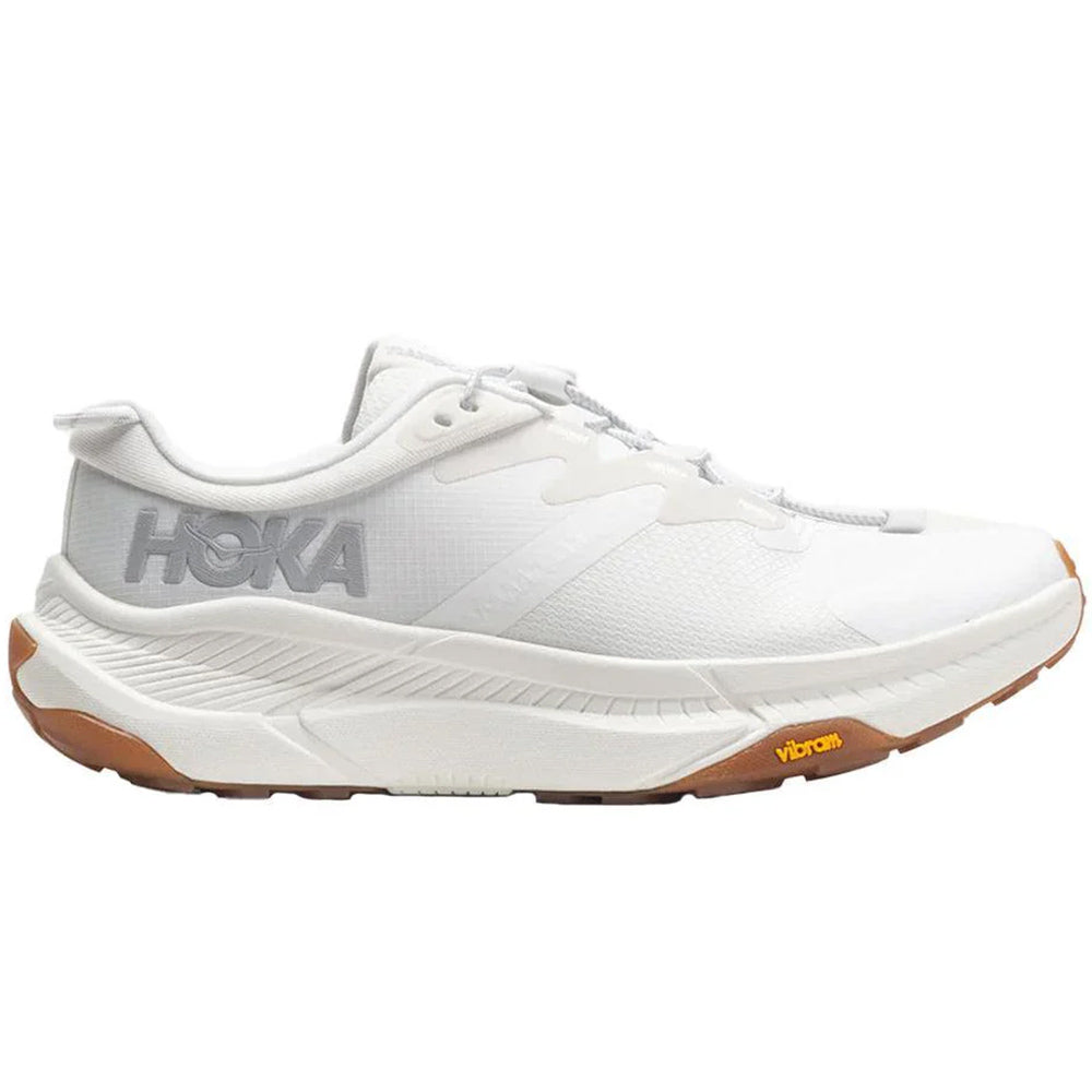 Side view on white background of Womens Hoka Transport running shoe in White/White, Medium (Regular) width