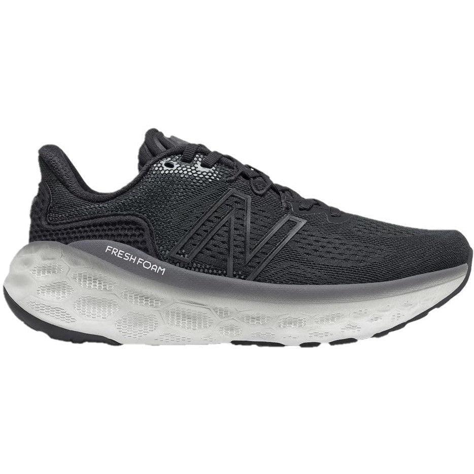 Side view on white background of Womens New Balance Fresh Foam More running shoe in Black/Magnet/Black Metallic, Medium (Regular) width