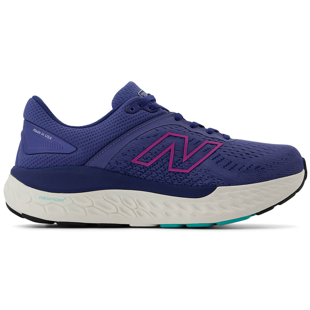 Side view on white background of Womens New Balance 1540 running shoe in Night Sky/Cosmic Rose, Wide width