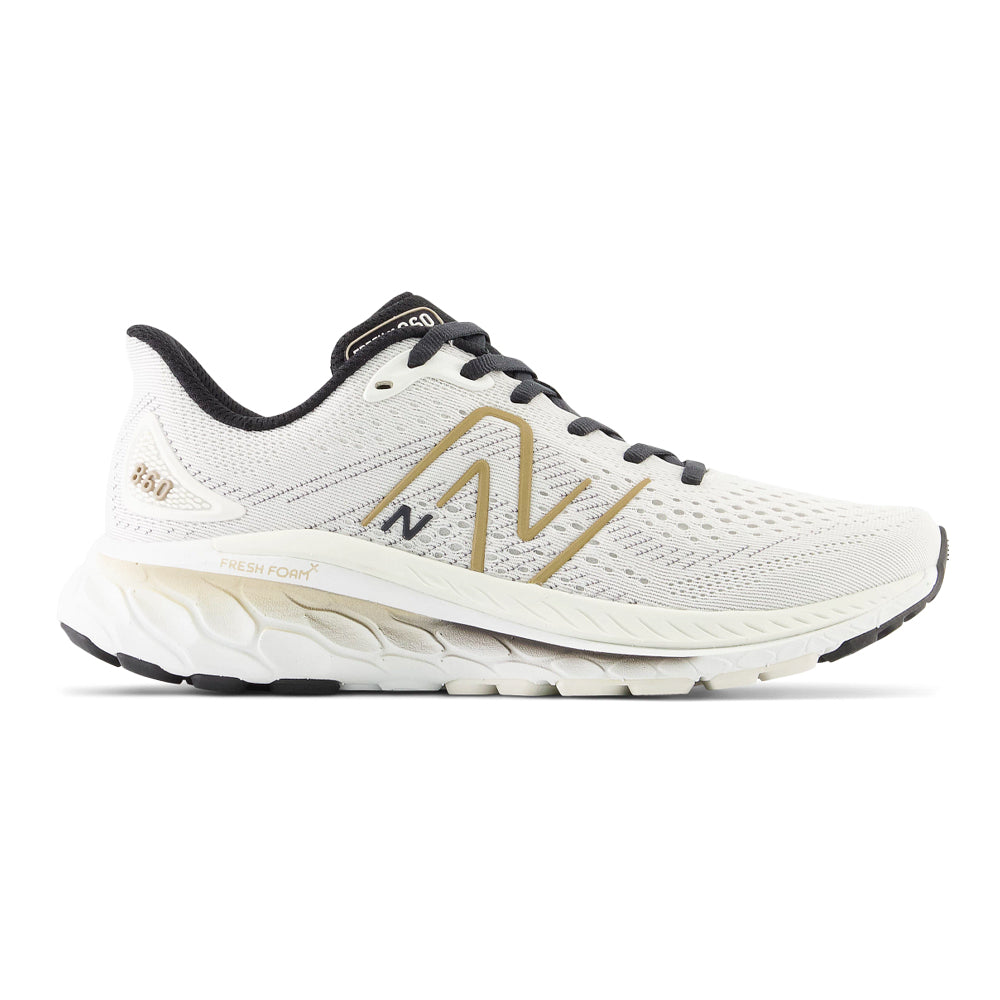 Side view on white background of Womens New Balance Fresh Foam X 860v13 running shoe in Sea Salt/Black, Wide width