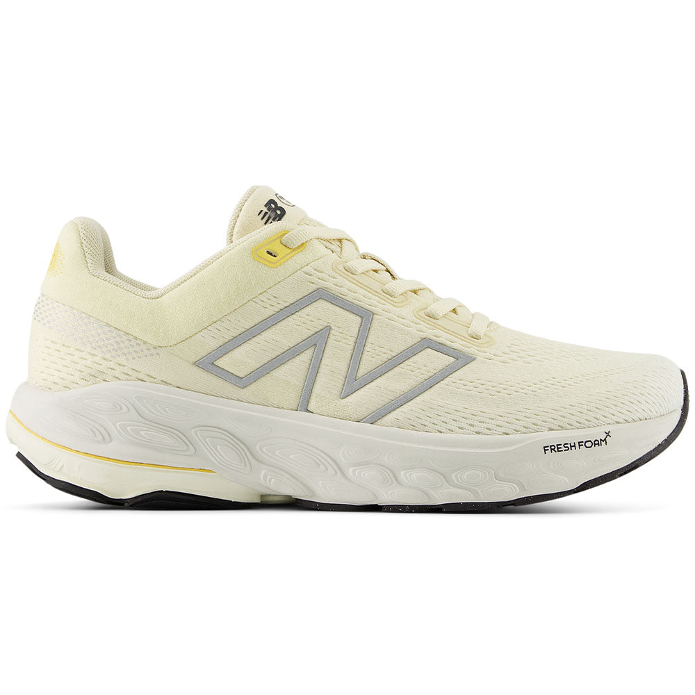 Side view on white background of Womens New Balance Fresh Foam 860 running shoe in Calcium/Sea Salt/Clementine, Wide width