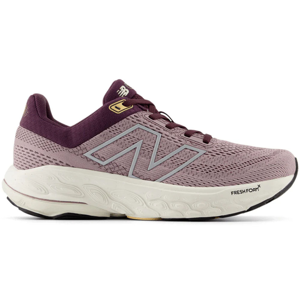 Side view on white background of Womens New Balance Fresh Foam 860 running shoe in Ice Wine/Plum Brown/Silver Metallic, Extra Wide width
