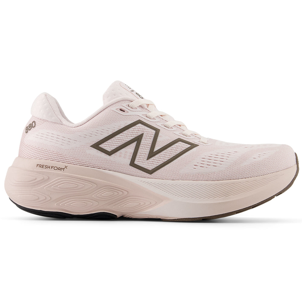 Side view on white background of Womens New Balance Fresh Foam 880 running shoe in Pink Salt/Cortado, Medium (Regular) width