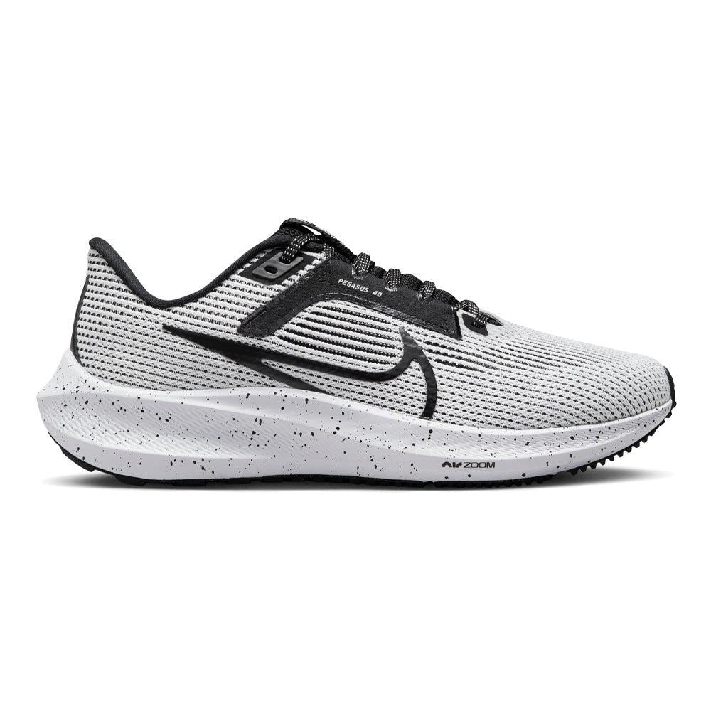 Side view on white background of Womens Nike Pegasus running shoe in Black/White, Medium (Regular) width