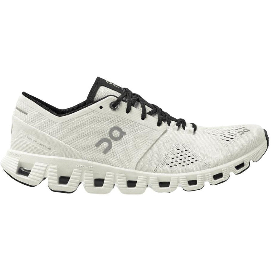 Side view on white background of Womens On Cloud X running shoe in White/Black, Medium (Regular) width