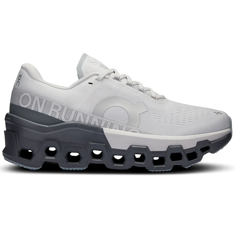 Side view on white background of Womens On Cloudmonster running shoe in Frost/Rock, Medium (Regular) width