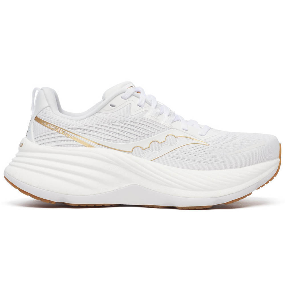 Side view on white background of Womens Saucony Hurricane running shoe in White/Gold, Medium (Regular) width