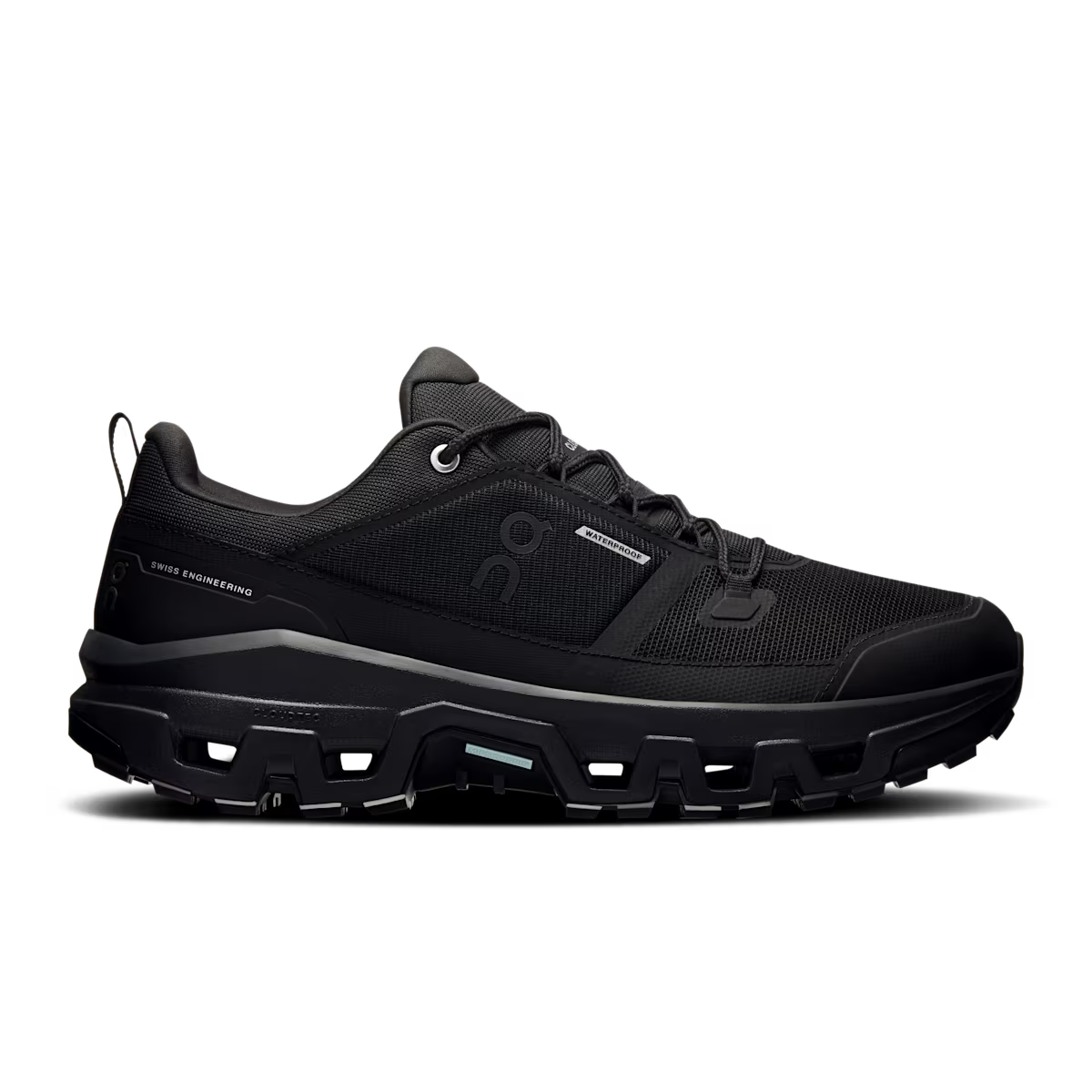 Side view on white background of Mens On Cloudrock Low Waterproof running shoe in Black/Black, Medium (Regular) width