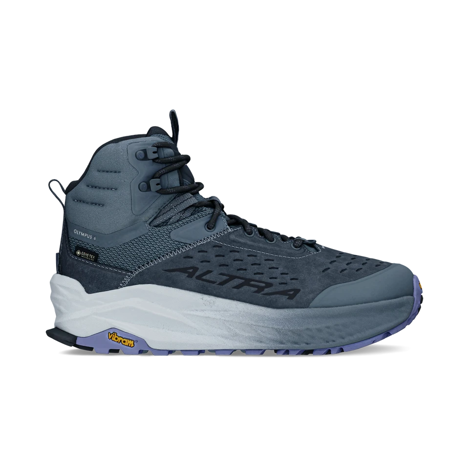 Side view on white background of Womens Altra Olympus 6 Hike Mid GTX running shoe in Dark Blue, Medium (Regular) width