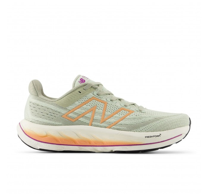 Side view on white background of Womens New Balance Fresh Foam Vongo v6 running shoe in Natural Mint/Light Gold Metallic/Copper, Medium (Regular) width