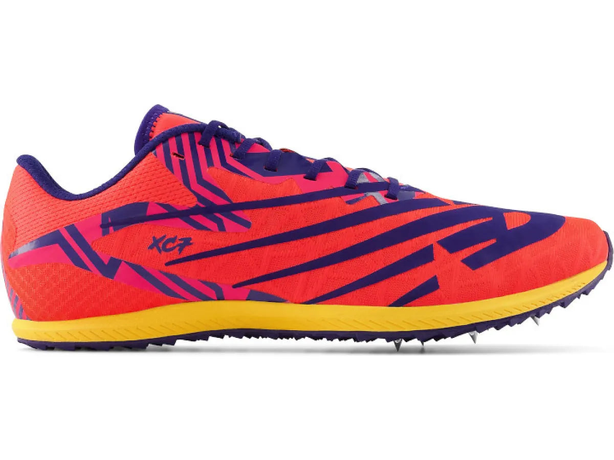 Side view on white background of Mens New Balance XC Seven v4 running shoe in Electric Indigo/Marine Blue, Medium (Regular) width