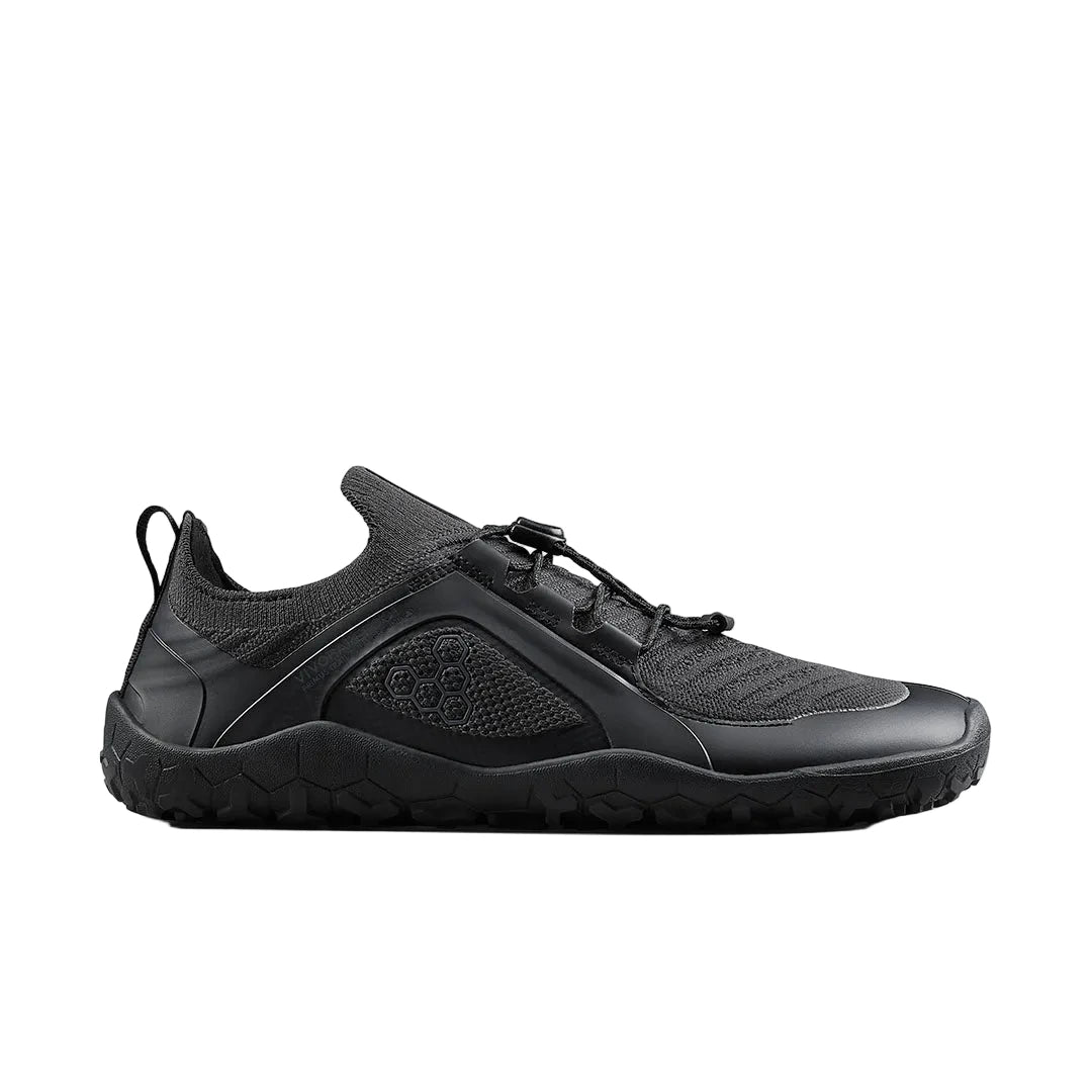 Side view on white background of Mens Vivobarefoot Primus Trail Knit FG running shoe in Black, Medium (Regular) width