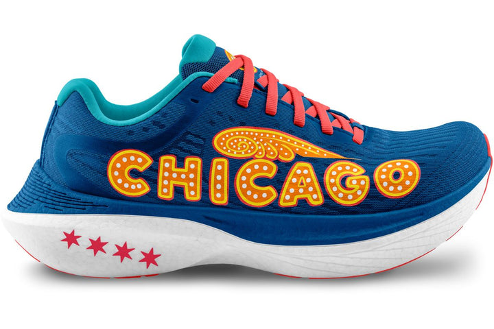 Side view on white background of Womens Topo Athletic Specter 2 Chicago running shoe in Navy/Orange, Medium (Regular) width