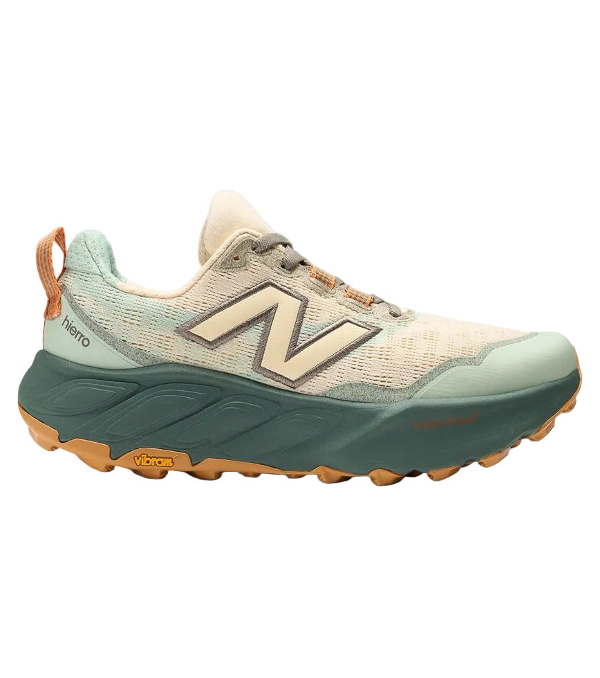 Side view on white background of Womens New Balance Fresh Foam X Hierro V9 running shoe in Calcium/Dark Juniper, Medium (Regular) width