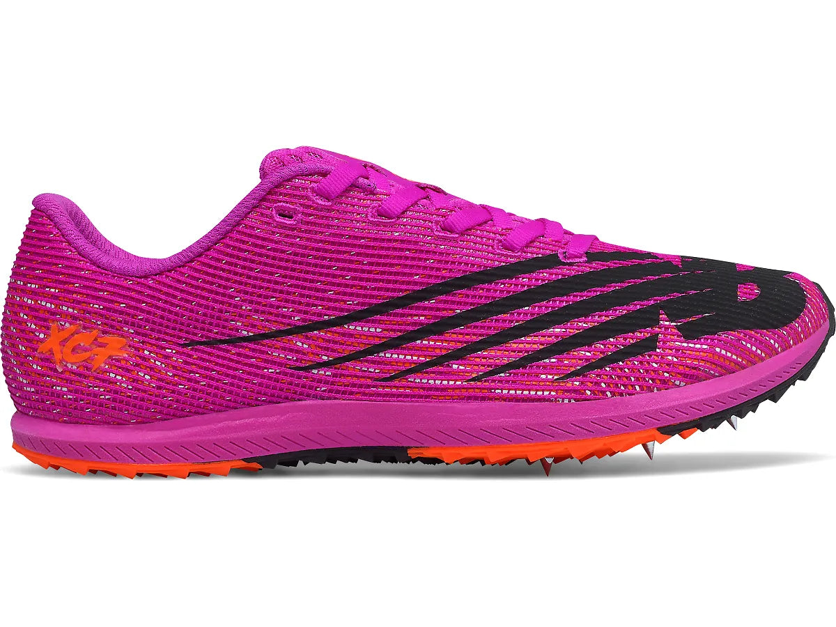 Side view on white background of Womens New Balance XC Seven V3 Spike running shoe in Poisonberry/Dynamite, Medium (Regular) width