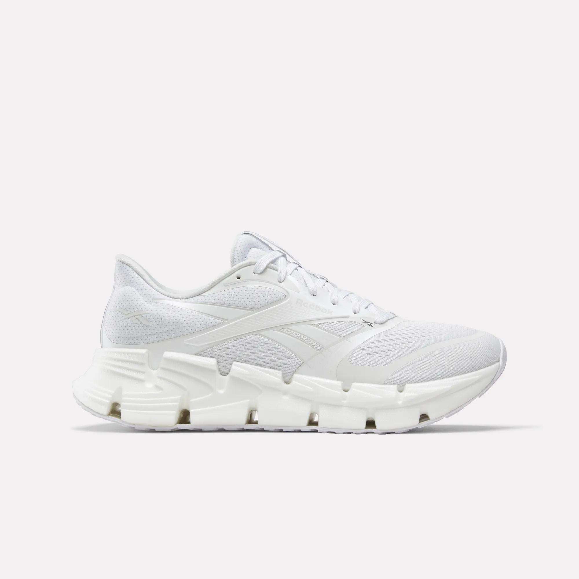 Side view on white background of Mens Reebok Floatzig 2 running shoe in White/White/White, Medium (Regular) width