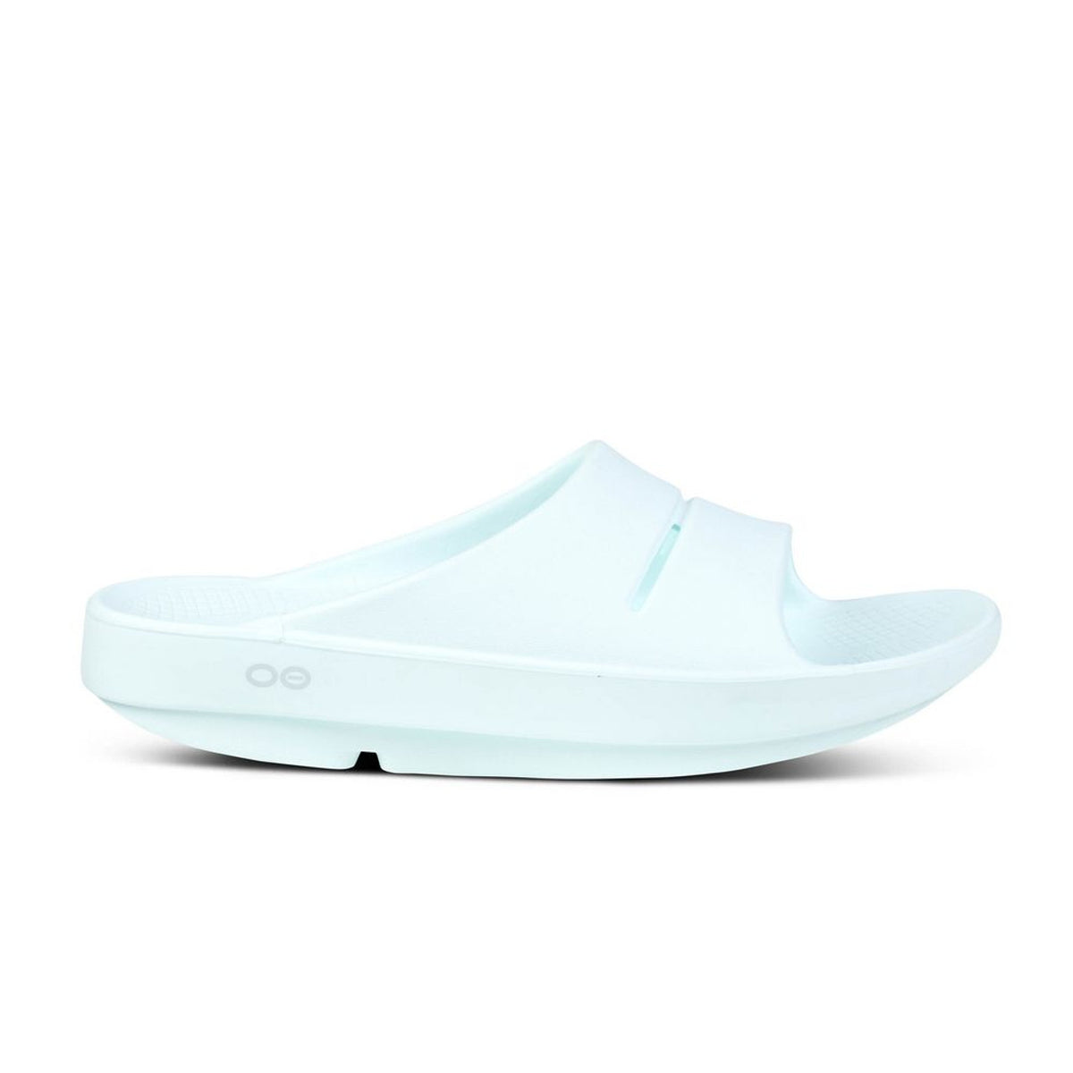 Side view on white background of Womens OOFOS Ooahh Slide running shoe in Ice, Medium (Regular) width