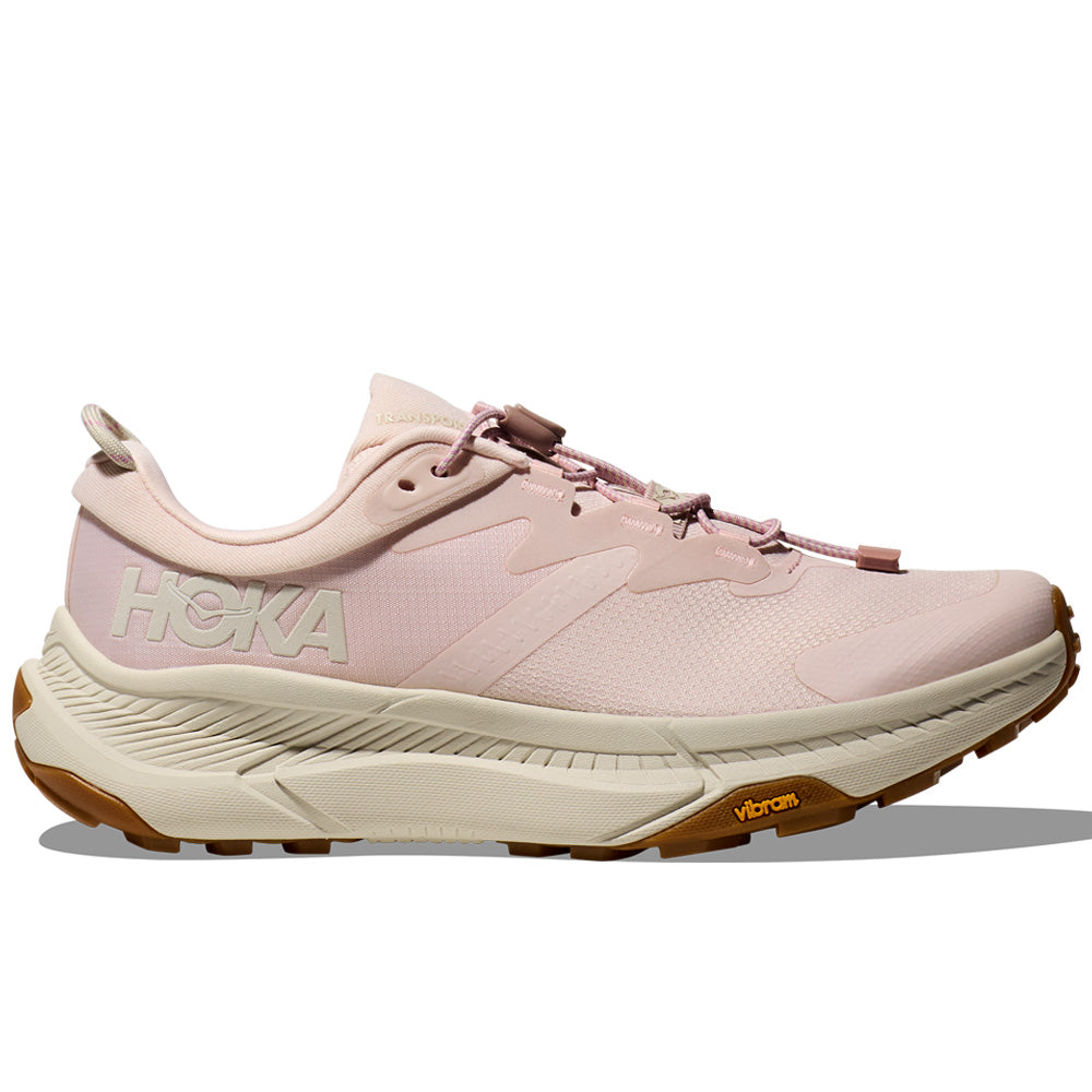 Side view on white background of Womens Hoka Transport running shoe in Cosmic Pearl/Oat Milk, Medium (Regular) width