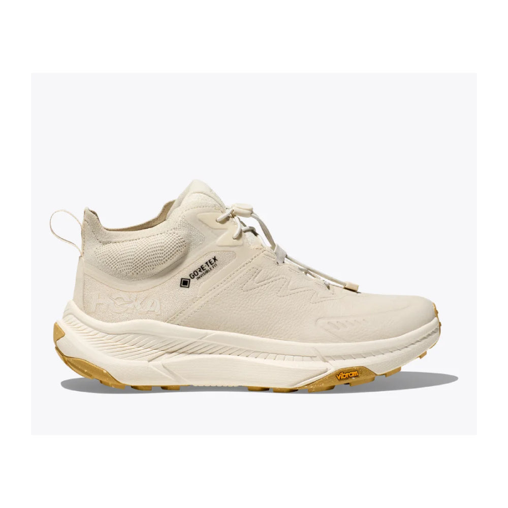 Side view on white background of Womens Hoka Transport running shoe in Oat Milk/Alabaster, Medium (Regular) width
