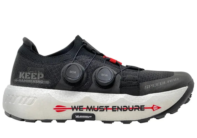 Side view on white background of Unisex Speedland GS:SFD running shoe in Black/White, Medium (Regular) width