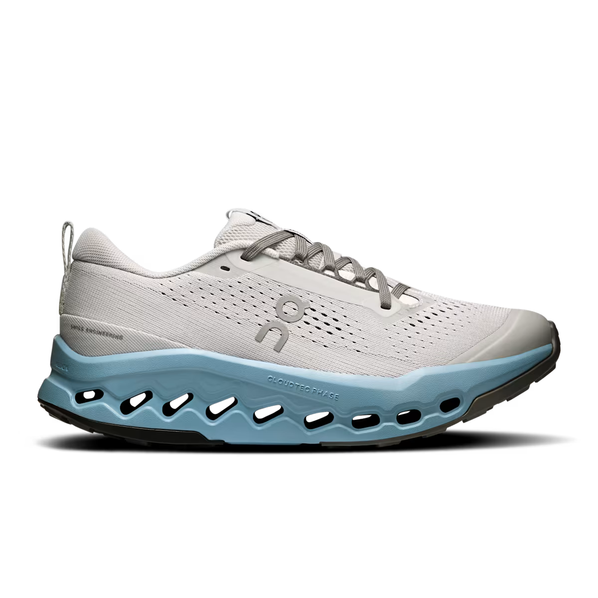 Side view on white background of Womens On Cloudsurfer Trail 2 running shoe in Glacier/Dust, Medium (Regular) width