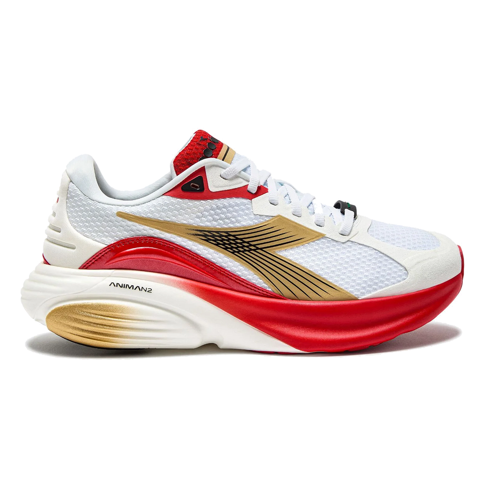 Side view on white background of Womens Diadora Atomo Star running shoe in White/Metallic Gold/Fiery Red, Medium (Regular) width