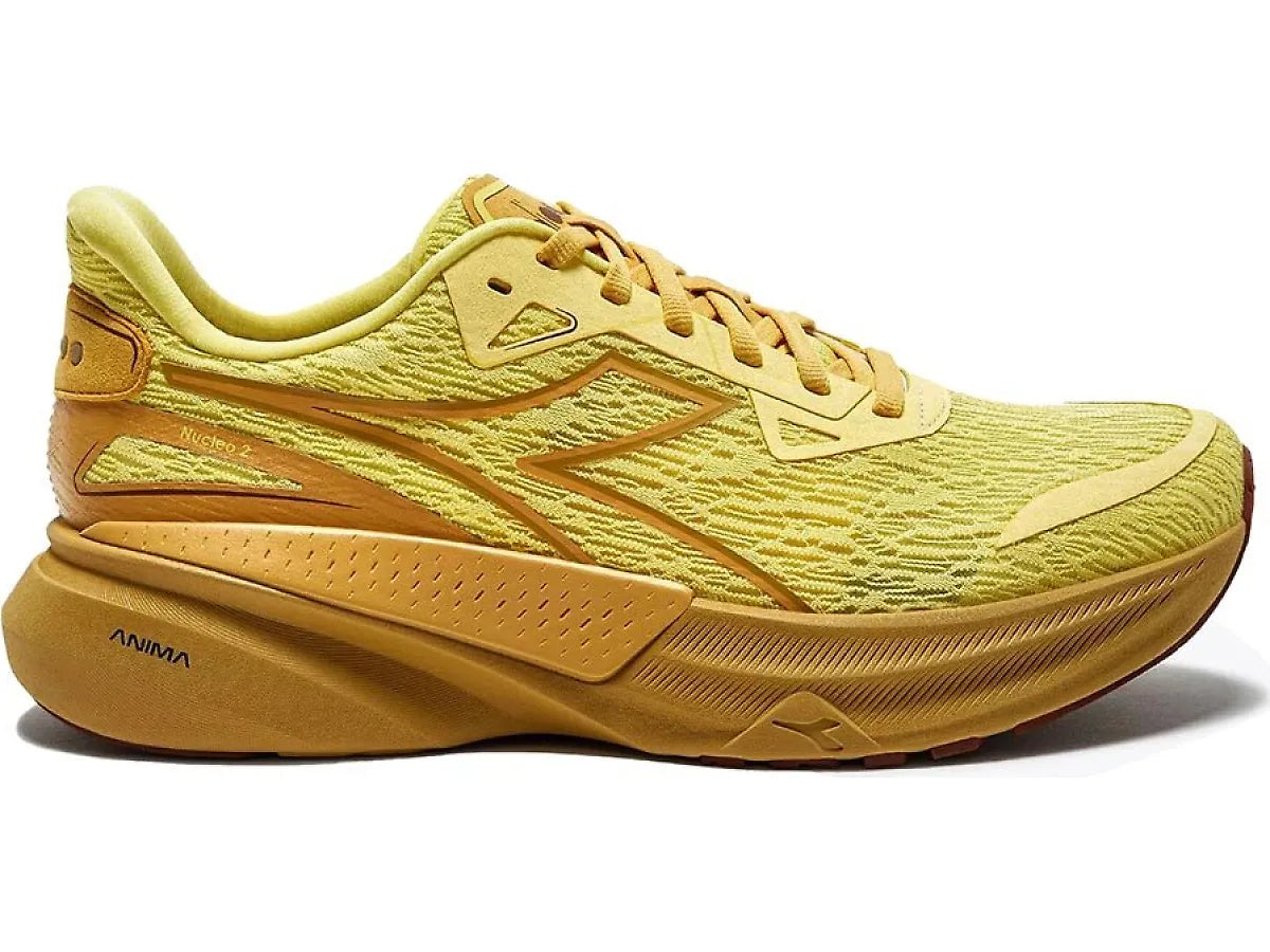 Side view on white background of Mens Diadora Nucleo 2 running shoe in Lemon Drop/Golden Apricot, Medium (Regular) width