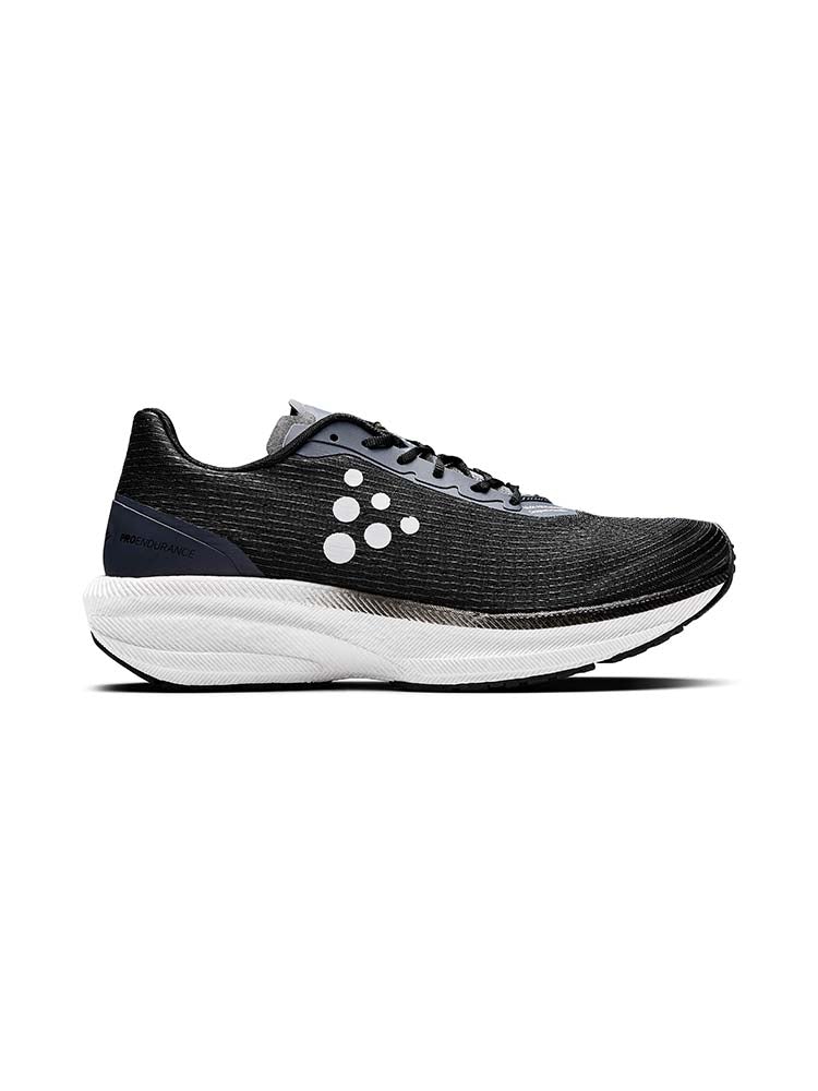 Side view on white background of Womens Craft Pro Endur running shoe in Black/White, Medium (Regular) width