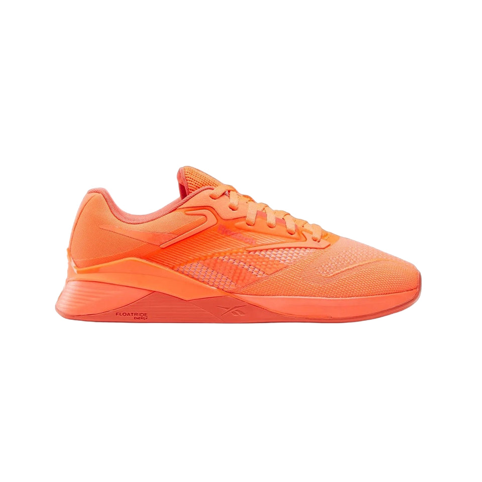 Side view on white background of Womens Reebok Nano X4 running shoe in Digital Coral/Semi Orange Flare, Medium (Regular) width