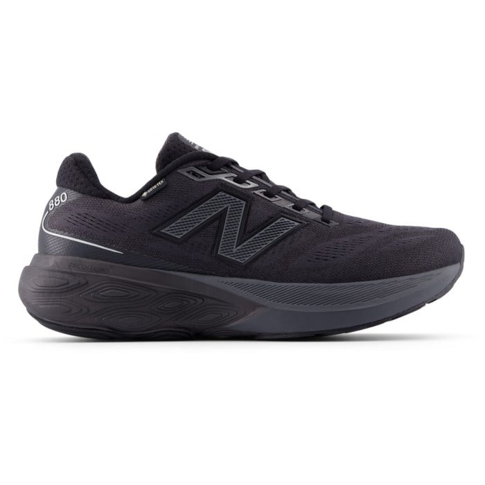 Side view on white background of Mens New Balance Fresh Foam X 880v15 GTX running shoe in Black/Castlerock/Silver Metallic, Wide width