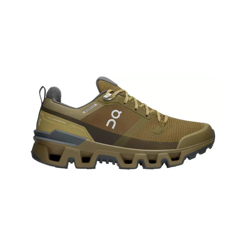 Side view on white background of Womens On Cloudwander Waterproof running shoe in Hunter/Safari, Medium (Regular) width