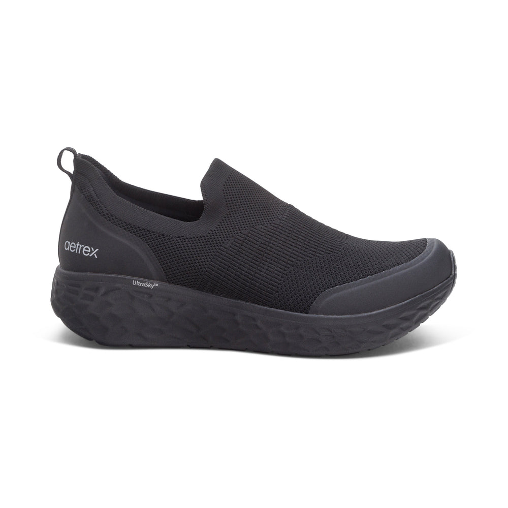 Side view on white background of Mens Aetrex Dash running shoe in Black/Black, Medium (Regular) width