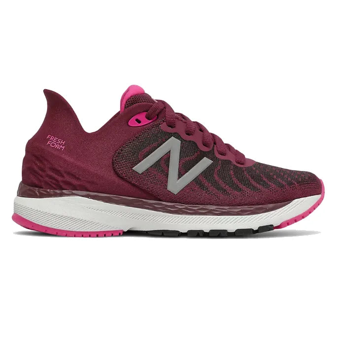 Side view on white background of Kids New Balance 860v11 running shoe in Garnet/Pink Glo, Medium (Regular) width