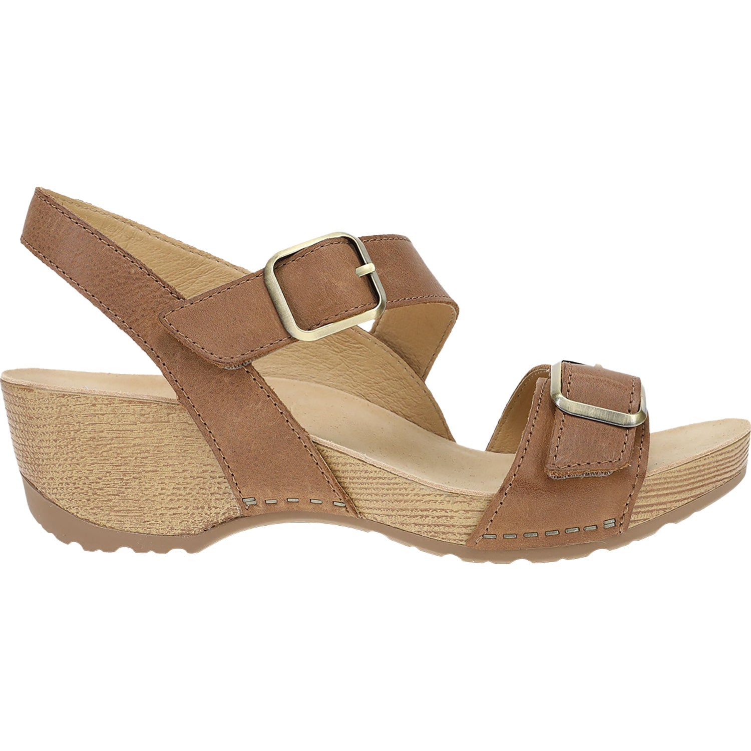 Side view on white background of Womens Dansko Trinity Burnished Nubuck running shoe in Tan, Medium (Regular) width