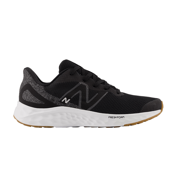 Side view on white background of Mens New Balance Arishi v4 running shoe in Black/Silver Metallic/Gum, Extra Wide width