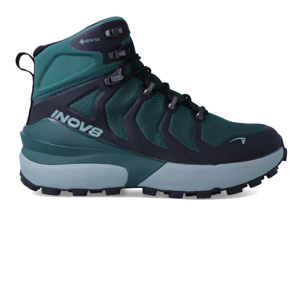 Side view on white background of Womens Inov8 Roclite Pro Mid GTX running shoe in Dark Green/Black, Wide width