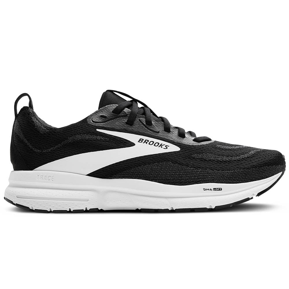 Side view on white background of Mens Brooks Trace running shoe in Black/Grey/White, Wide width