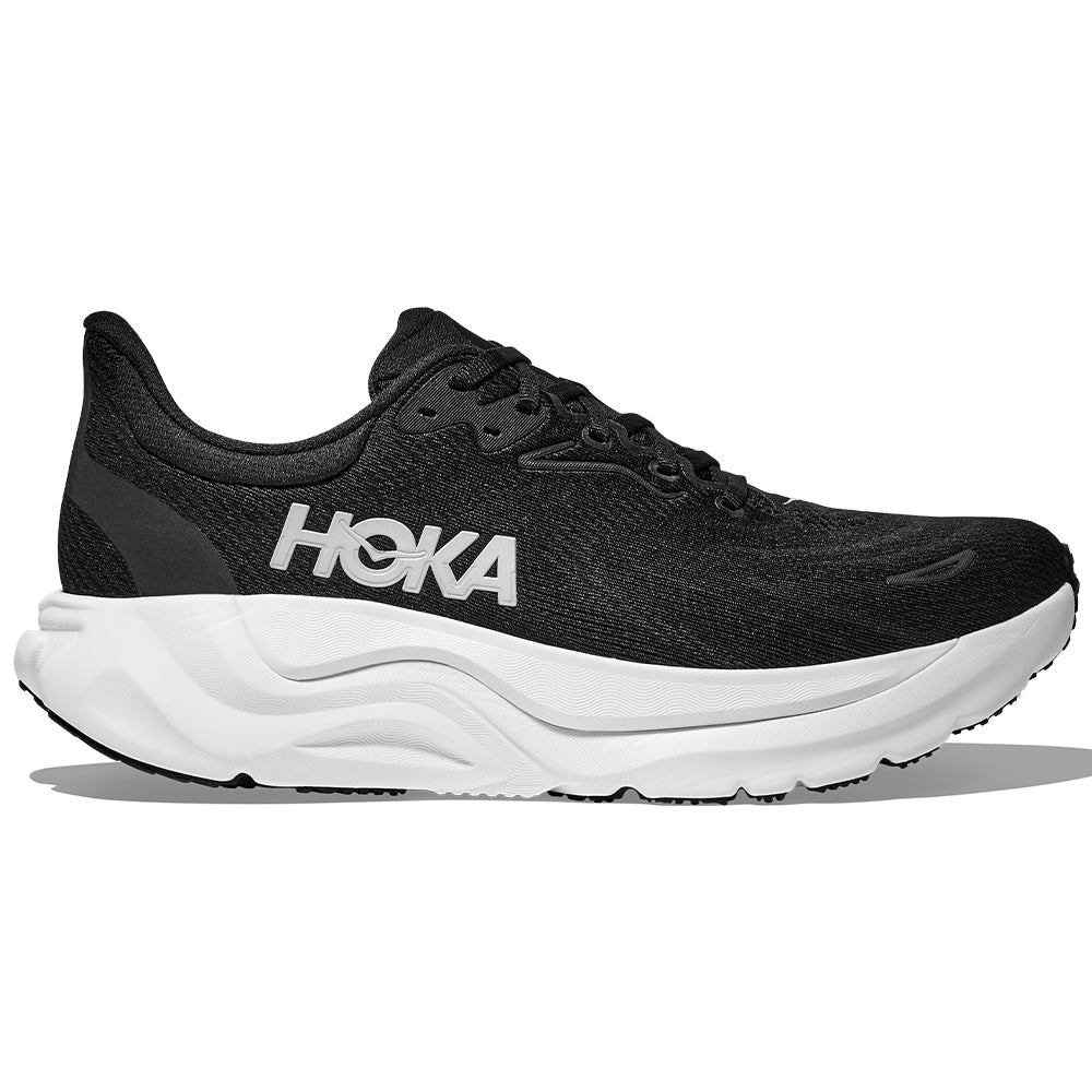 Side view on white background of Mens Hoka Arahi running shoe in Black/White, Medium (Regular) width