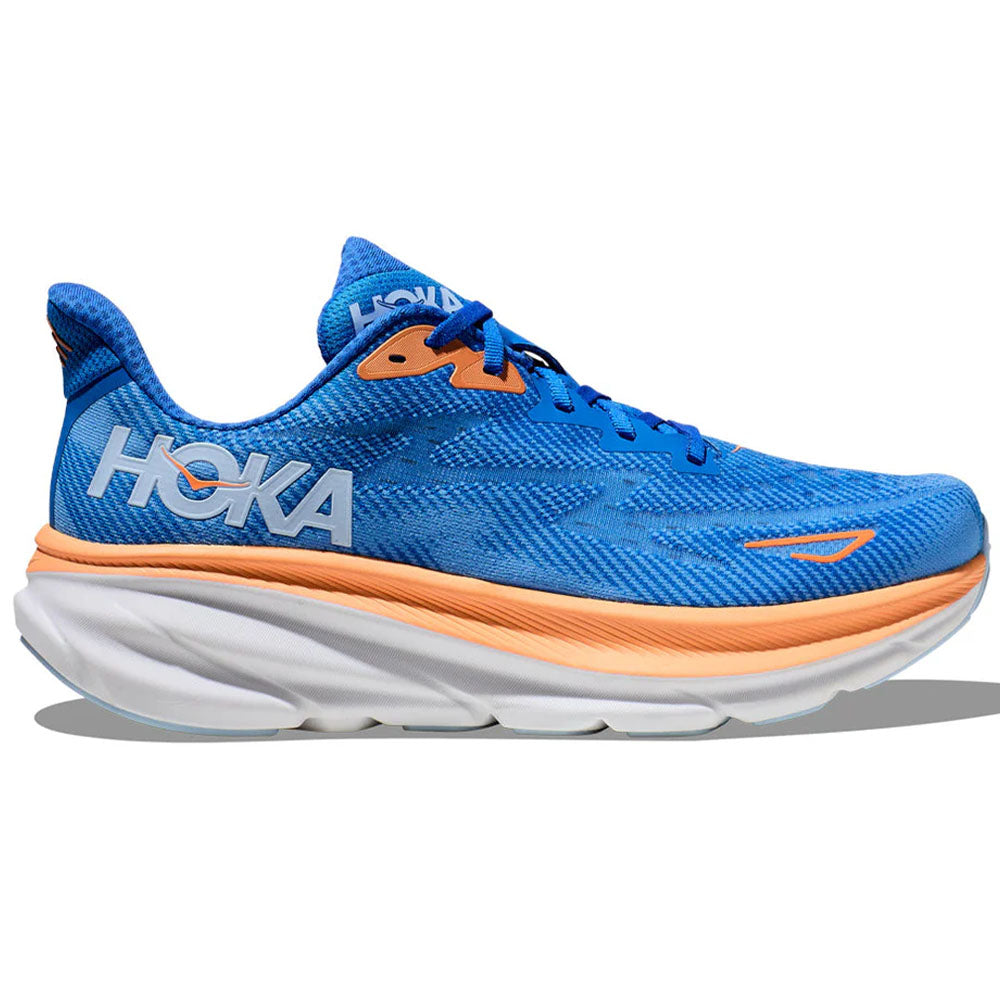 Side view on white background of Mens Hoka Clifton running shoe in Coastal Sky/All Aboard, Medium (Regular) width