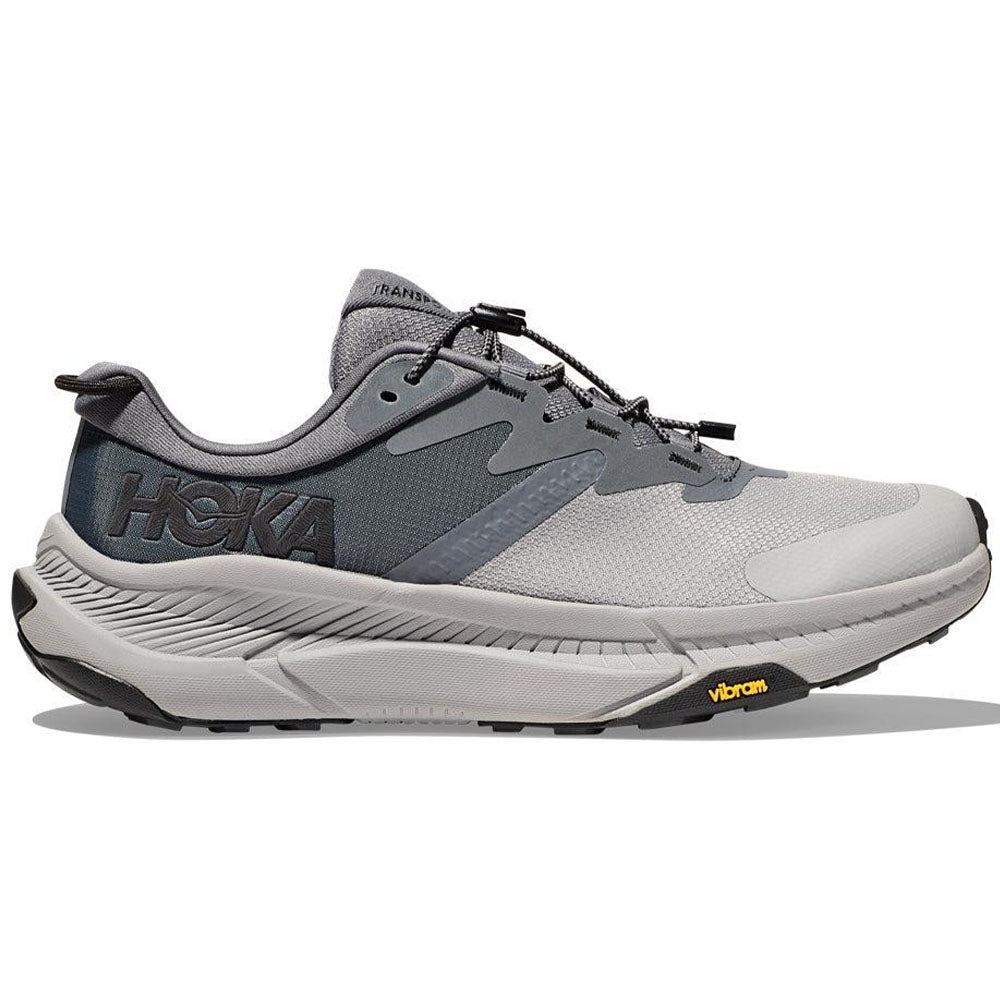 Side view on white background of Mens Hoka Transport running shoe in Castlerock/Black, Medium (Regular) width