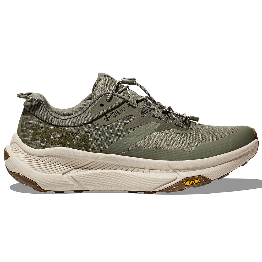 Side view on white background of Mens Hoka Transport running shoe in Slate/Oat Milk, Medium (Regular) width