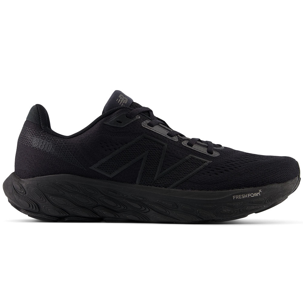 Side view on white background of Mens New Balance Fresh Foam 880 running shoe in Black/Black Metallic, Narrow width