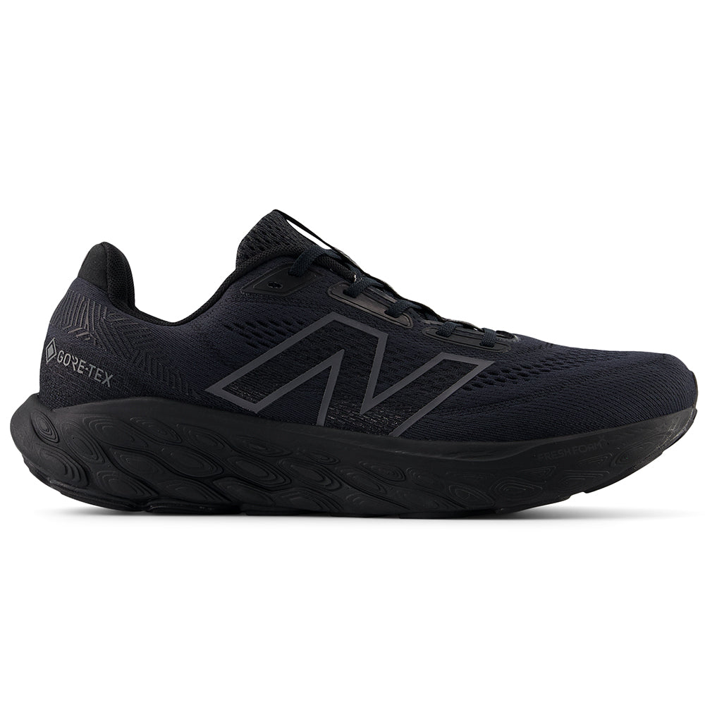 Side view on white background of Mens New Balance Fresh Foam X 880 running shoe in Black/Phantom/Magnet, Medium (Regular) width
