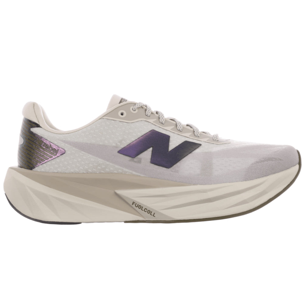 Side view on white background of Mens New Balance FuelCell Rebel running shoe in Shipyard/Arid Stone/Silver Metallic, Wide width
