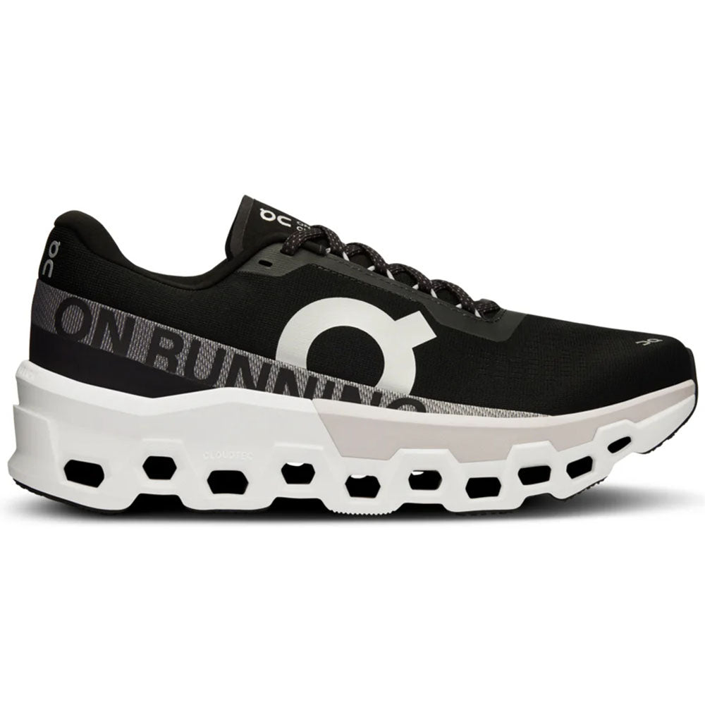 Side view on white background of Mens On Cloudmonster running shoe in Black/Frost, Medium (Regular) width