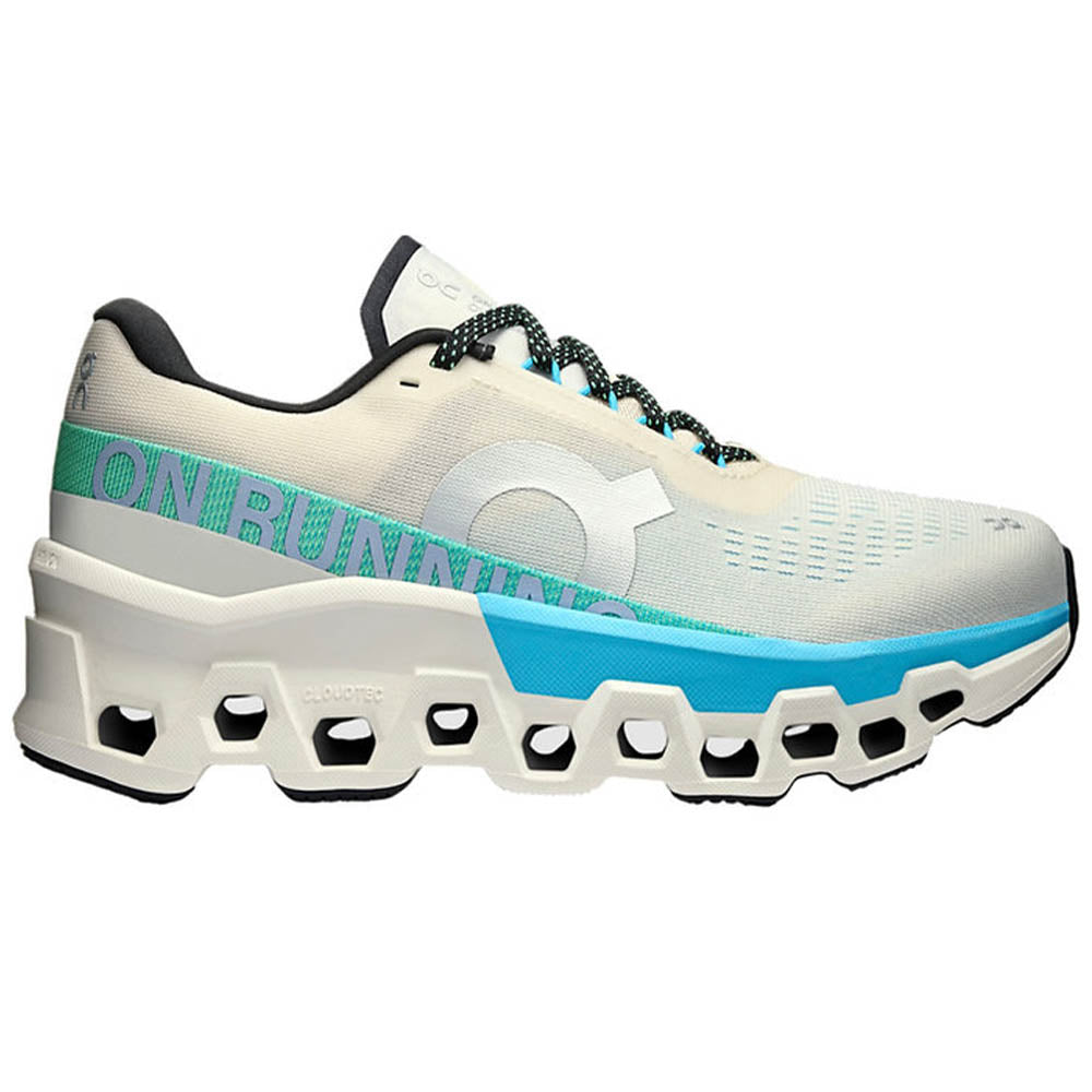 Side view on white background of Womens On Cloudmonster running shoe in Cream/Horizon, Medium (Regular) width