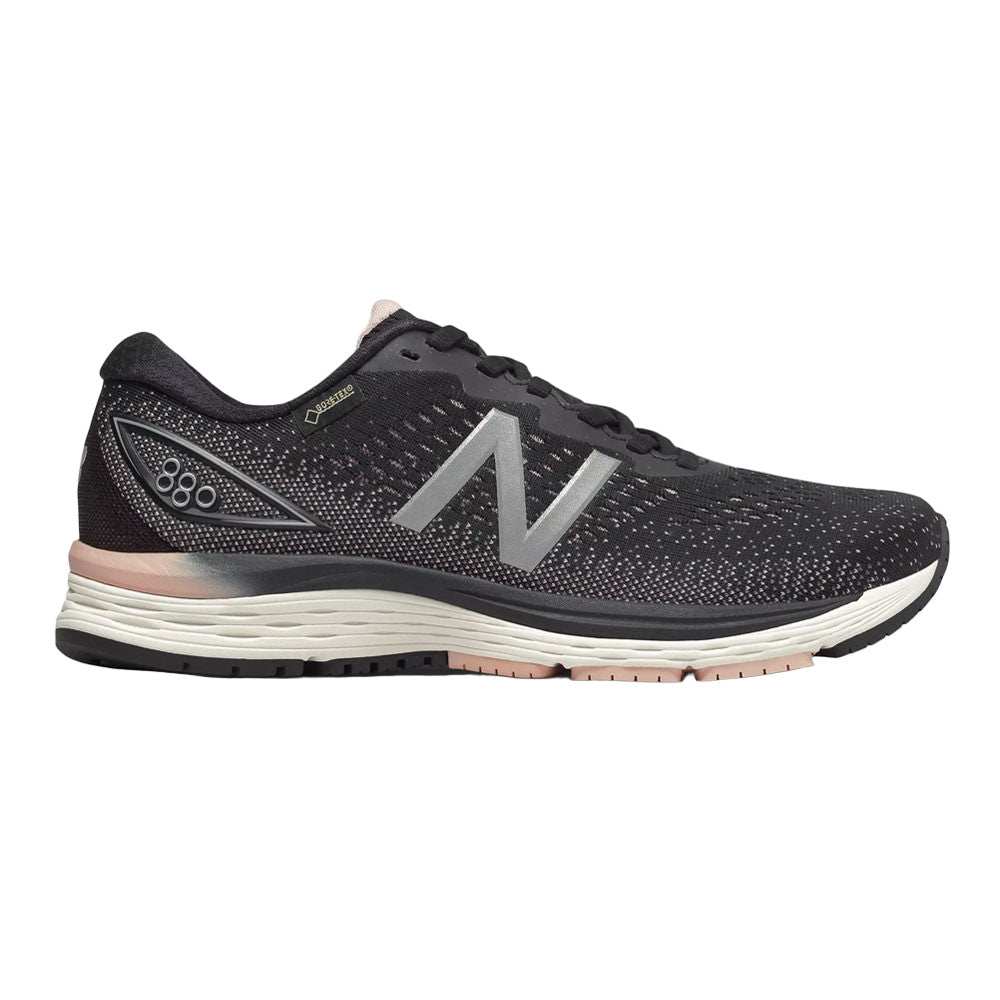 Side view on white background of Womens New Balance 880v9 GTX running shoe in Black, Wide width