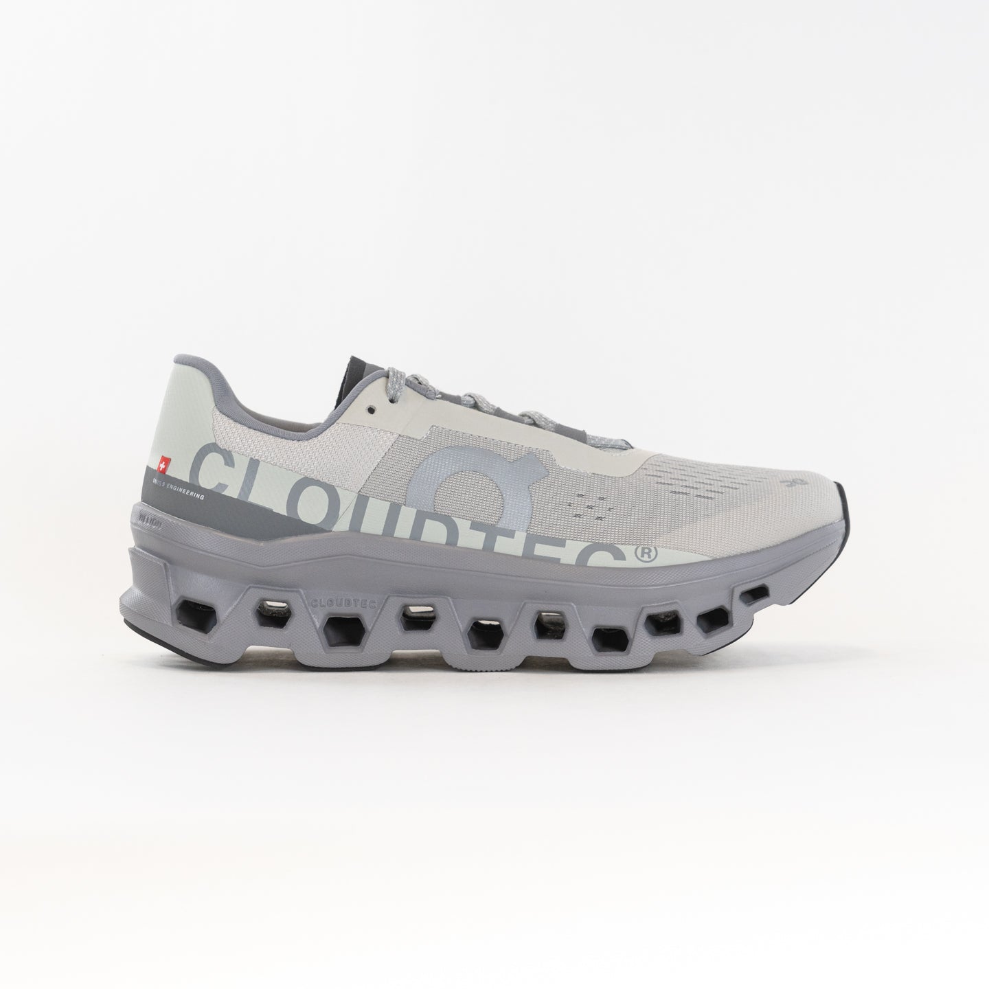 Side view on white background of Mens On Cloudmonster running shoe in Ice/Alloy, Medium (Regular) width