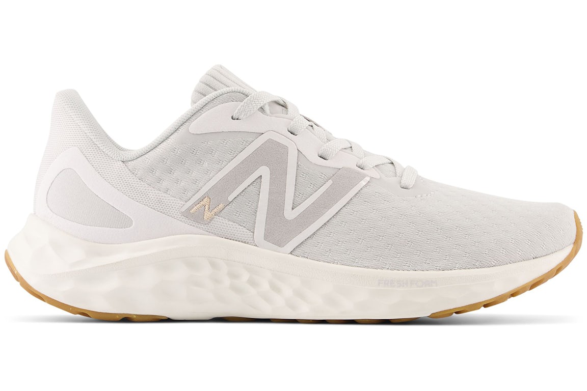Side view on white background of Womens New Balance Fresh Foam Arishi v4 running shoe in Summer Fog/Nimbus Cloud/Light Gold Metallic, Medium (Regular) width